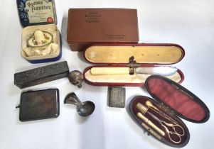 A cased etui set with gilt finish, in red lined box, together with a novelty white metal