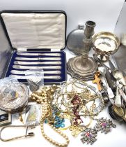 A group of silver and plated items, to include various silver mustard spoons, an Indian candlestick,