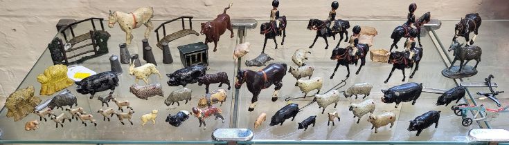 Hollow-cast lead farm animals and accessories by Britains and Johillco including two hay bales and