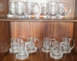 A group of Dartington glass mugs, various dates.