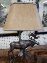 A bronze moose lamp. 57cm including lampshade. (Moose 29cm h)