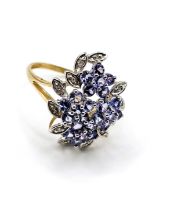 A 9ct yellow gold, diamond, and tanzanite cluster ring, size R.