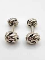 A pair of sterling silver cufflinks, of knotted ball design.