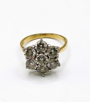 An 18ct yellow gold and diamond floral cluster ring, set with seven round brilliant-cut diamonds, of