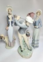 Lladro golfer, 28cm, lady with hound, 33cm, and lady with parasol, 32cm. (3)