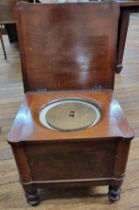 A late 19th century mahogany commode, hinged lid, raised on four turned legs. 44cm x 48cm x 42cm.