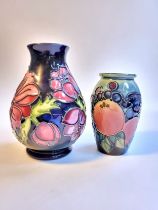 Two Moorcroft vases, 11cm and 14cm high (2)