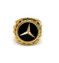 A 14ct yellow gold Mercedes ring, set with a black onyx plaque and the Mercedes-Benz logo,