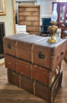 Three vintage brown leather suitcases, (approx. 32cm x 91cm x 56cm each) together with an oil lamp