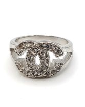 A silver and cubic zirconia cocktail ring, in a designer style, marked 925, size O 1/2.