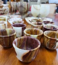 A collection of x39 pieces of Onyx to include egg cups, bowls goblets and a table lamp.