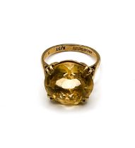 A 9ct yellow gold and single stone citrine ring, set with a round-cut citrine measuring