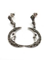 A pair of silver and marcasite drop earrings in the form of a crescent moon, 3.2 cm long.