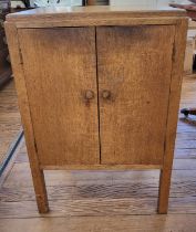 A light oak cutlery cupboard with various cutlery. 79cm x 53cm.