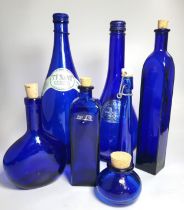 A group of seven decorative blue glass bottles, various sizes. (7)