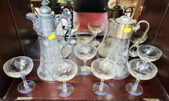 Two glass claret jugs with plated mounts, 30cm and 26cm, and six Babycham glasses (one lacks image