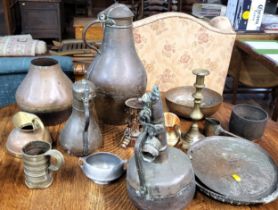 A collection of various brassware including pots, jugs, bowls, a candlestick, etc.