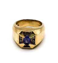 An unusual 14k gents ring, set with an oval-cut tanzanite measuring approximately 7.2 x 5.1 mm,