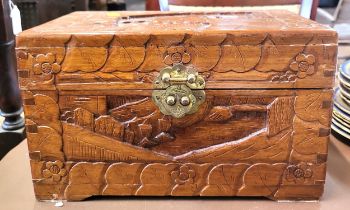 A Chinese miniature carved wooden casket, with brass lock.