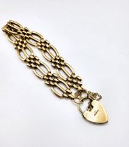 A 9ct yellow gold fancy gate-link bracelet, marked 375, fastened with a 9ct yellow gold heart-shaped