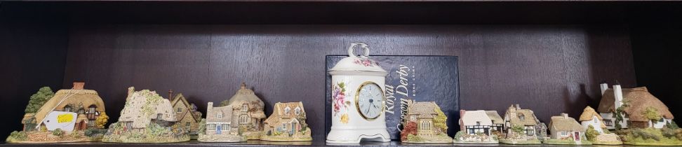 A Royal Crown 'Derby Posies' pattern clock with original box and fifteen Lilliput Lane Cottages.