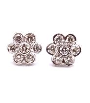 A pair of 18ct white gold and diamond floral cluster ear studs, the round brilliant-cut diamonds