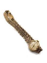 A 9ct yellow gold ladies Accurist wristwatch, with baton dial, 21 jewel movement, on articulated 9ct