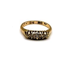 A late Victorian 18ct yellow gold and diamond ring, set with five old-cut diamonds, the largest
