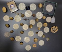 A small group of militaria buttons, a Defence medal, badges, coins including half crowns, crowns,