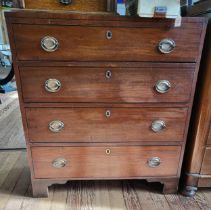 A mahogany graduated four drawer chest of drawers on bun feet. 102cm x 91cm x45cm.