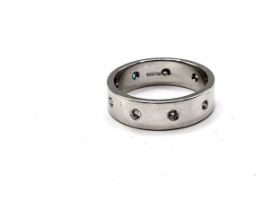 An 18ct white gold and diamond set eternity ring, the band inset with small round-cut diamonds