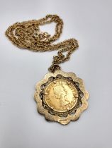 A 1966 full sovereign mounted in a 9ct yellow gold double border pendant, suspended on a 9ct