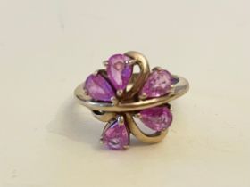 A 9ct yellow gold and pink sapphire cluster ring, set with five pear-cut pink sapphires, size M 1/2.