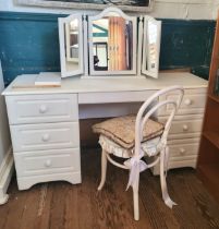 A white dressing table with three drawers each side, and triple vanity mirror. 77cm x 149cm x