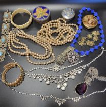 A small group of costume jewellery, including faux pearl necklace, a paste necklace, a bone