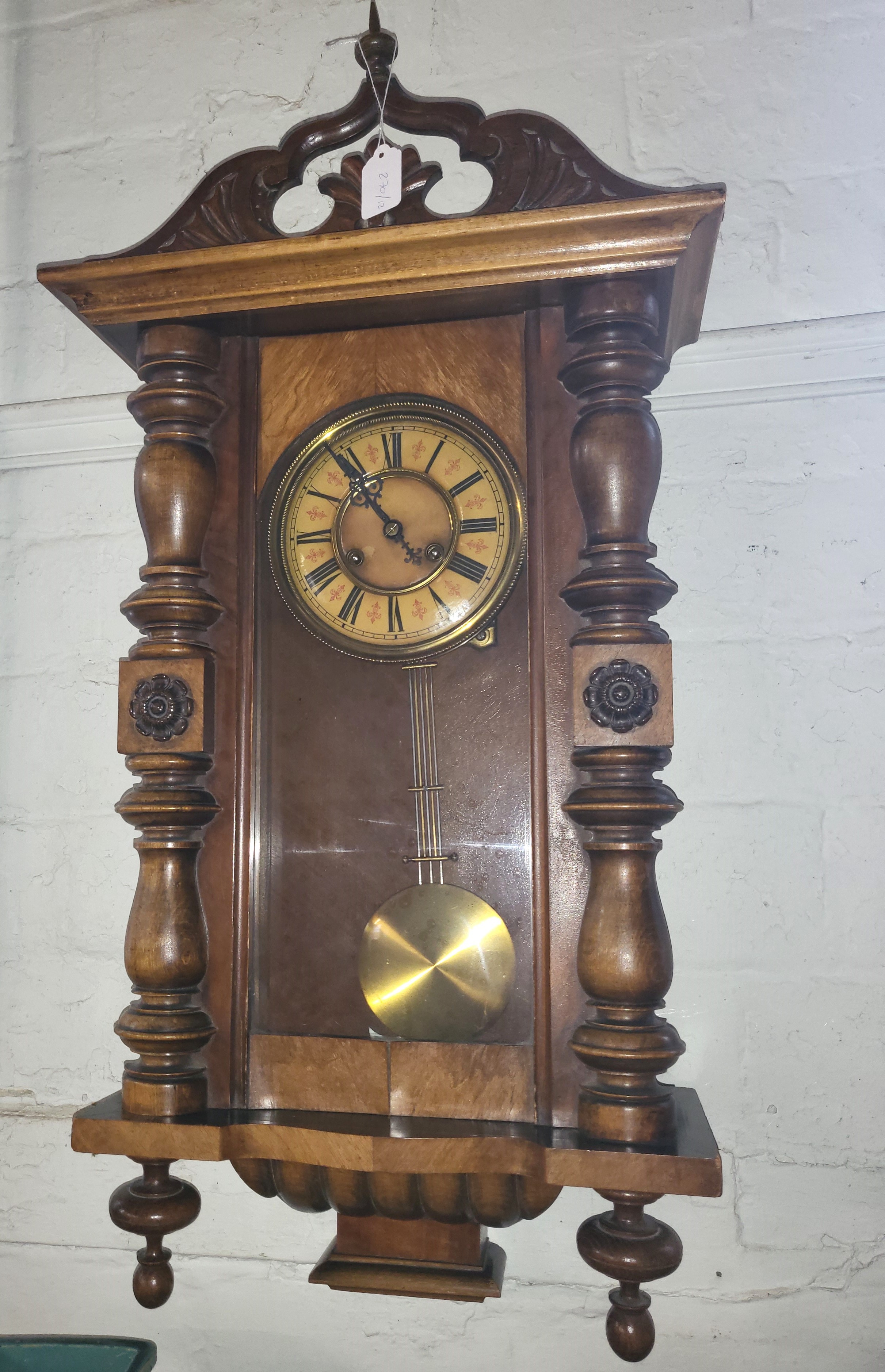 A walnut cased wall clock