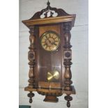 A walnut cased wall clock