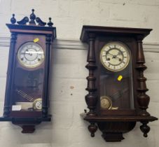 Two wooden cased wall clocks, on with broken pediment and finial decoration, the other with turned
