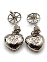 A pair of 18ct white gold and diamond heart earrings, marked 18ct and 750.