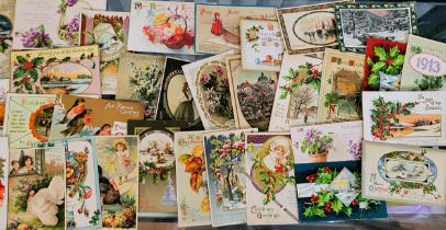 A small collection of vintage postcards, mainly depicting Christmas