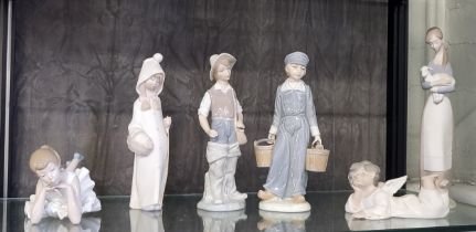 Five Lladro figures including lady holding lamb 27cm (chip to lamb's ear) and Nao ballet dancer