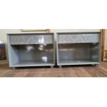 A pair of grey open cabinets with a single drawer. 61cm x 77cm x 50cm.