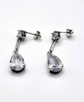 A pair of cubic zirconia drop earrings marked 925, and butterflies, boxed. Rhodium plated silver.