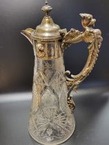 A late 19th / early 20th century silver-plate mounted cut glass claret jug, the handle with caryatid