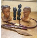 Two carved tribal busts, two carved tribal figures and assorted tribal daggers.