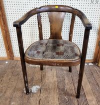 A mahogany chair with curved splatted back, raised on four legs.