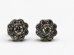 A pair of 18ct white gold and diamond floral cluster earrings, total diamond weight approximately