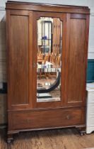 A 20th century mahogany mirrored-door wardrobe, with central mirror and two side doors, interior