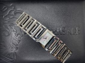 Versace. A stainless steel ladies wristwatch, with rectangular mother-of-pearl dial, Roman numeral