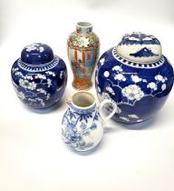 A Chinese blue and white prunus blossom Ginger jar with lid, 16.5cm, a larger Ginger jar (with